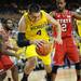 Michigan freshman Mitch McGary attempts to keep control of the ball during the second half against North Carolina State at Crisler Center on Tuesday night. Melanie Maxwell I AnnArbor.com